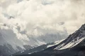 Cloud-covered mountain range close to one of the hotel rooms in Switzerland.